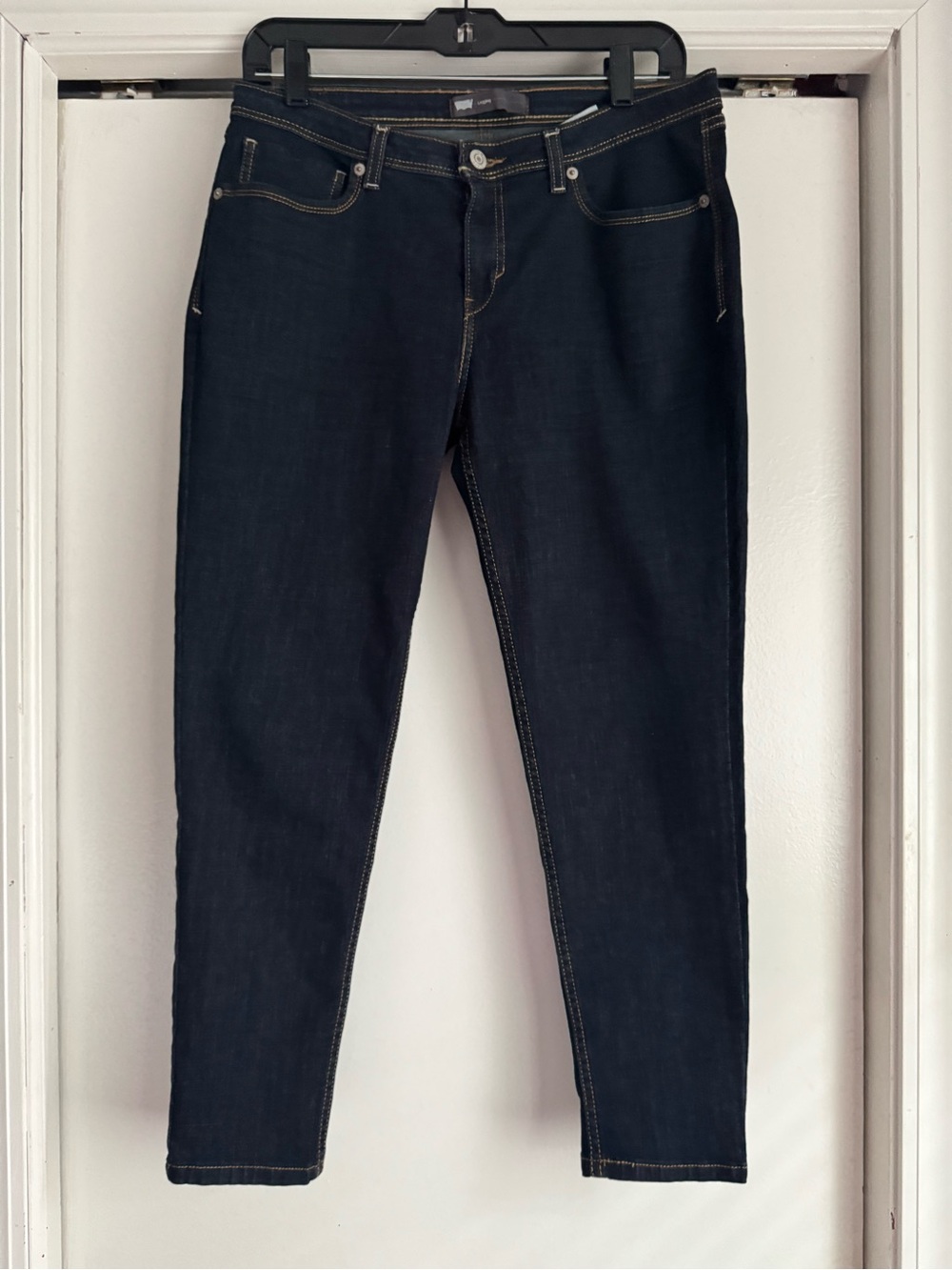 Levi's Revel Skinny Demi Curve jeans feature a dark wash and distinct contoured